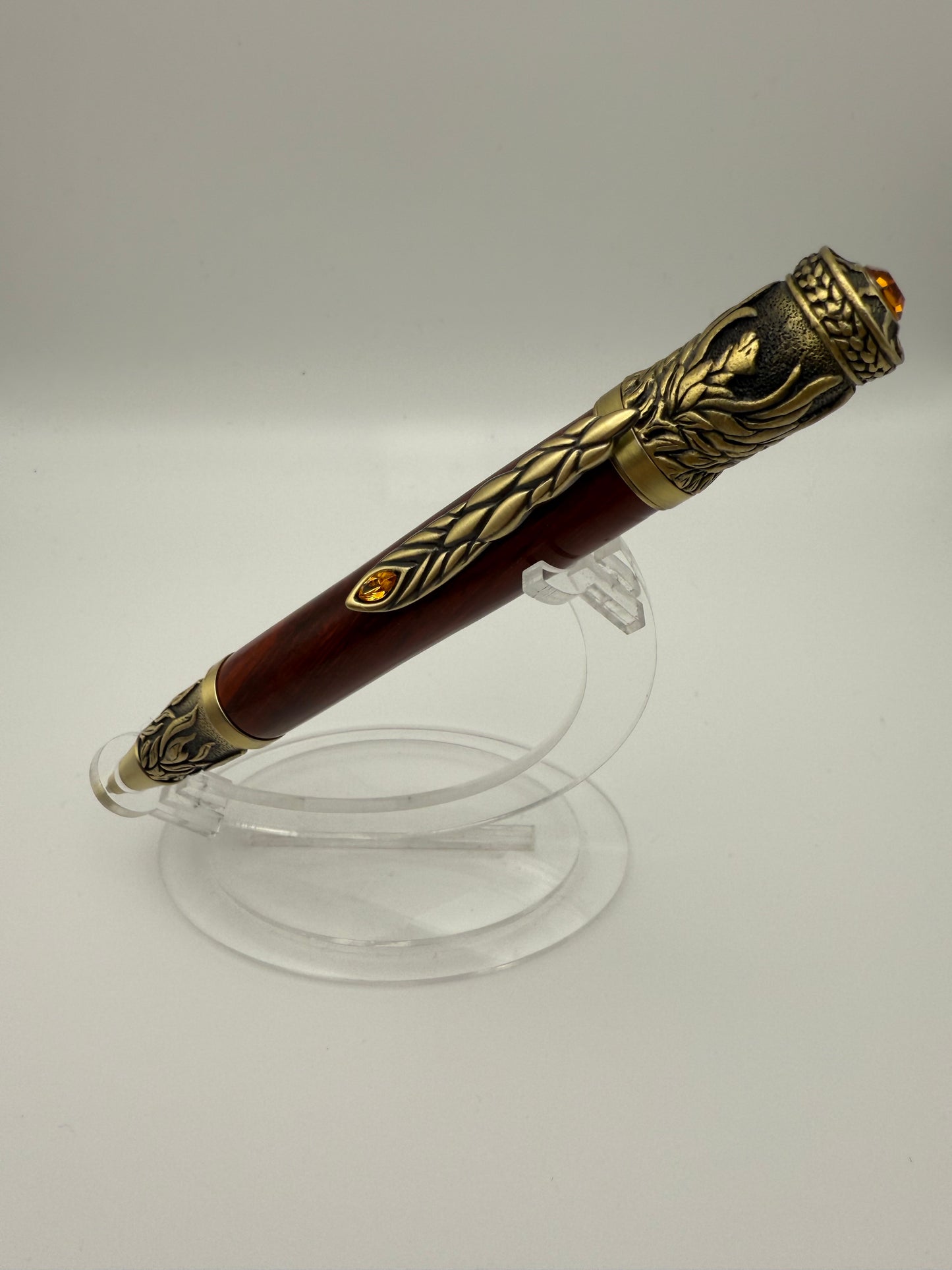 Handmade Wooden Pen: Padauk Phoenix Rising in Brass